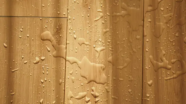 Water beads on wood flooring